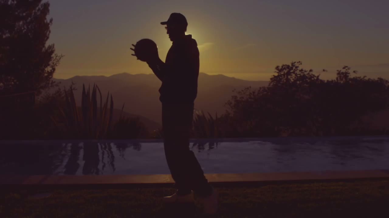 Scottie Pippen holding the Game 5 BALL in front of a California sunset